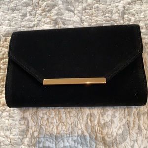 Black velvet clutch with gold chain